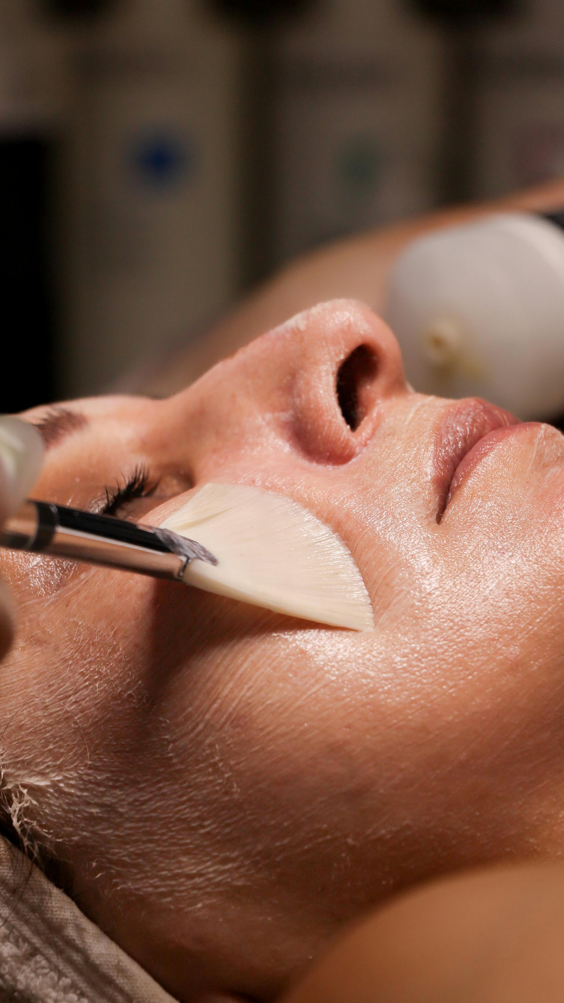 Skin treatment in progress at Bloom Skin Clinic — facial mask brush application